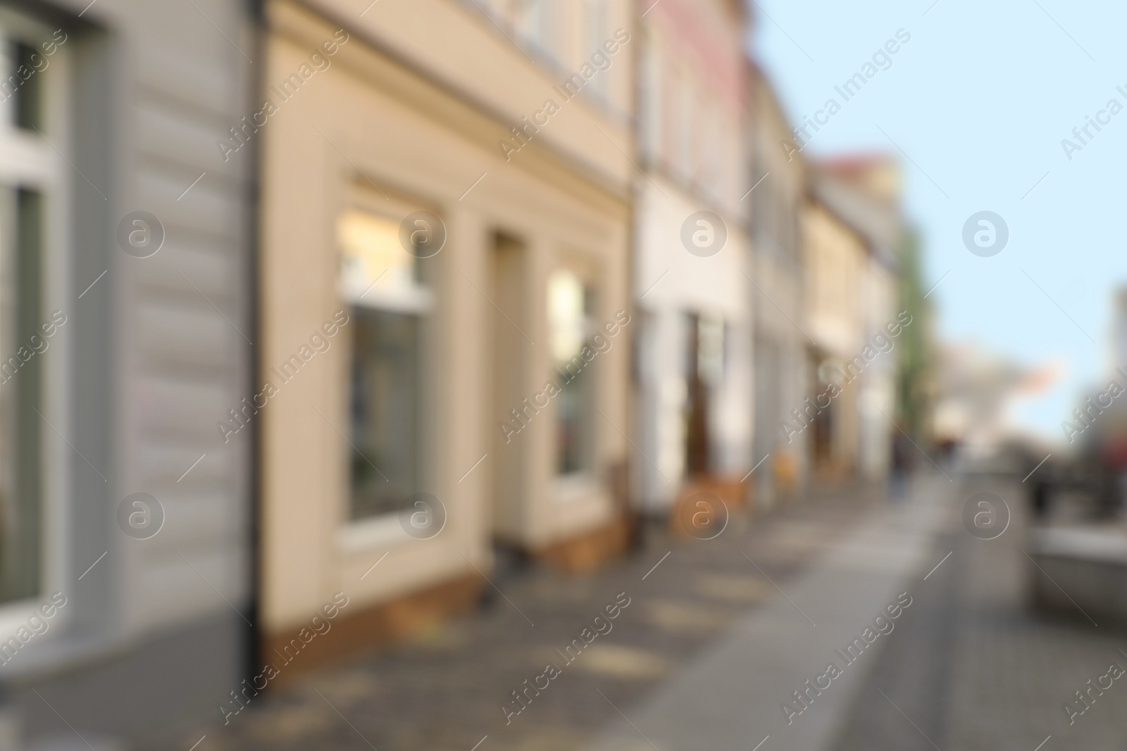 Photo of Blurred view of city street with beautiful buildings. Bokeh effect