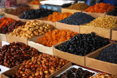 Photo of Delicious dried fruits on counter at wholesale market