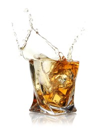 Whiskey splashing out of glass on white background