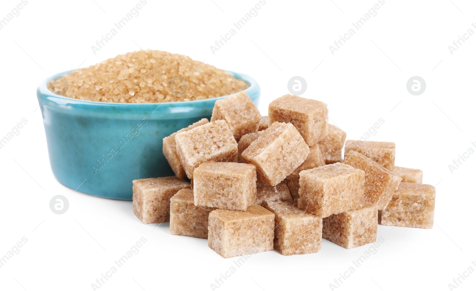 Photo of Different types of brown sugar and bowl isolated on white