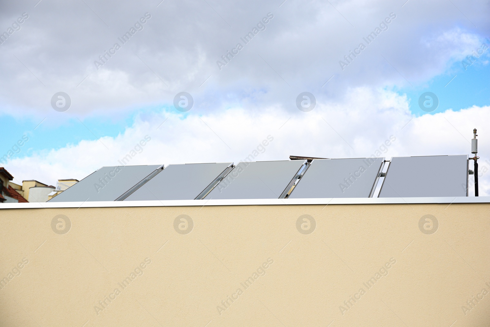 Photo of Solar panels under blue sky on sunny day. Alternative energy source