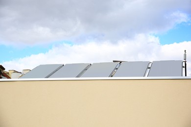 Solar panels under blue sky on sunny day. Alternative energy source