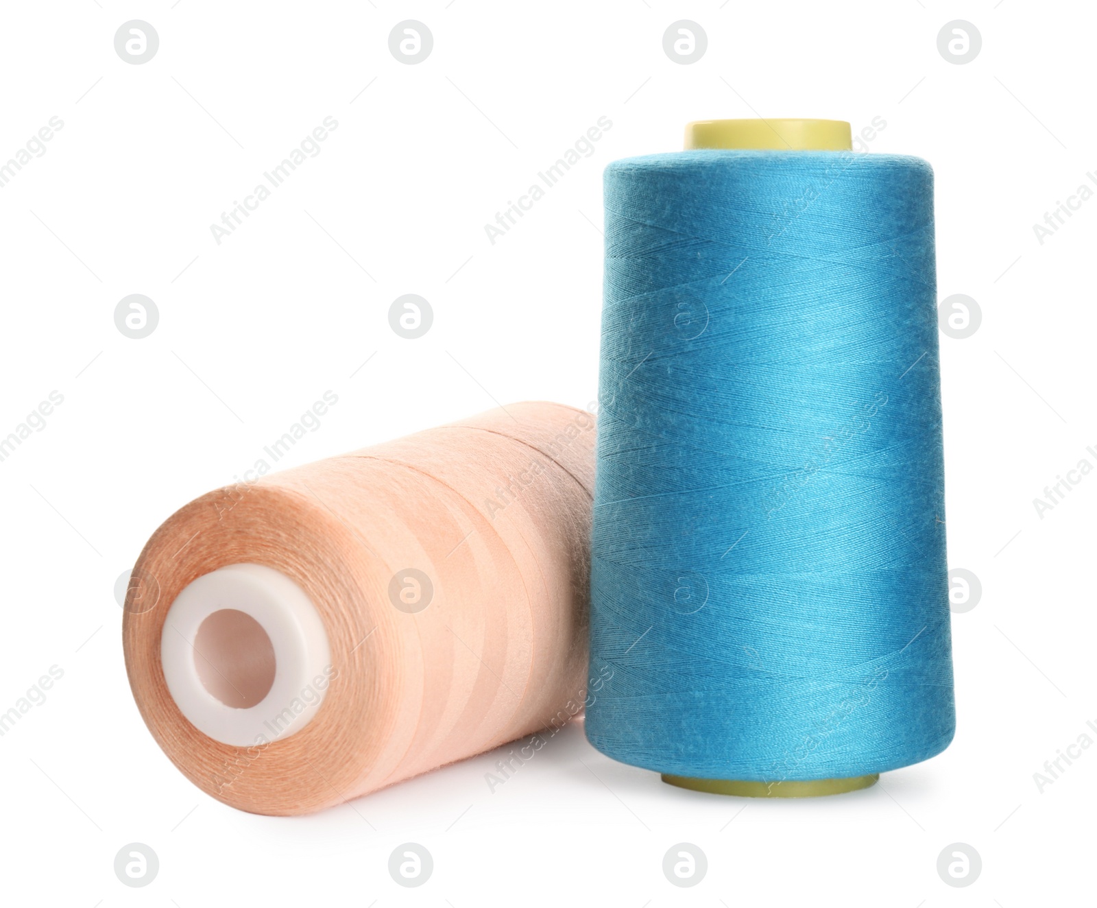 Photo of Different colorful sewing threads on white background