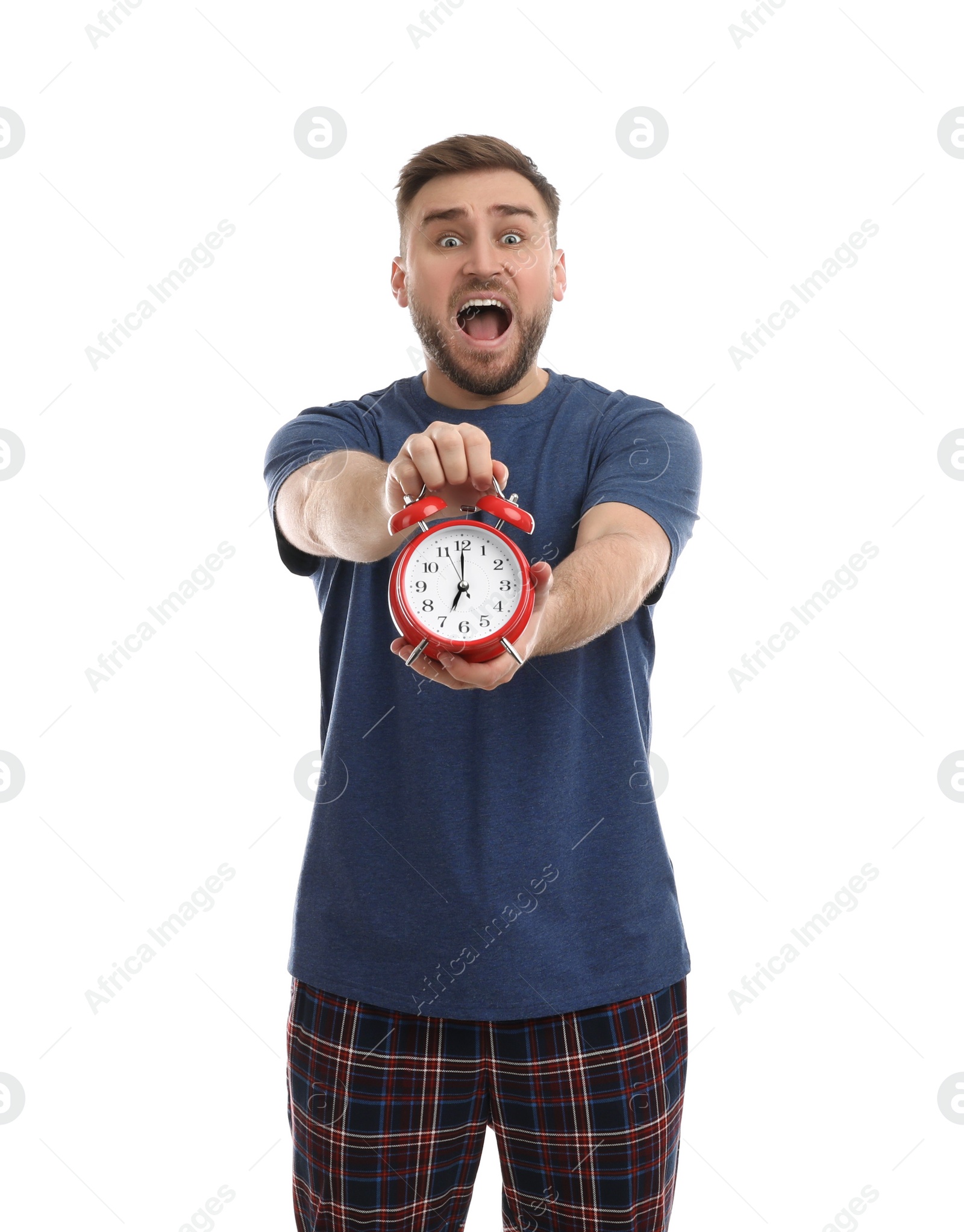 Photo of Emotional overslept man with alarm clock on white background. Being late concept