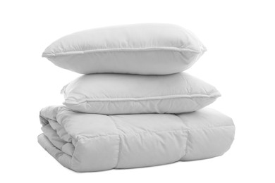 Photo of Soft blanket with pillows on white background