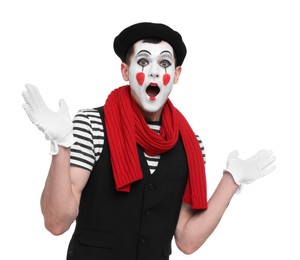 Mime artist making shocked face on white background