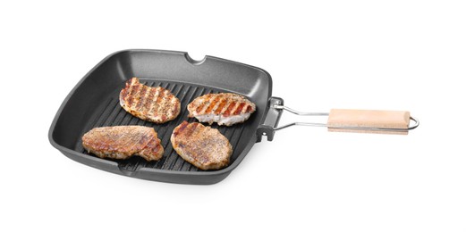 Photo of Grill pan with delicious pork steaks isolated on white