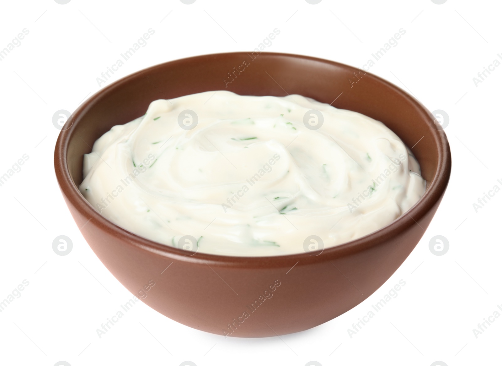 Photo of Tasty creamy dill sauce in bowl isolated on white