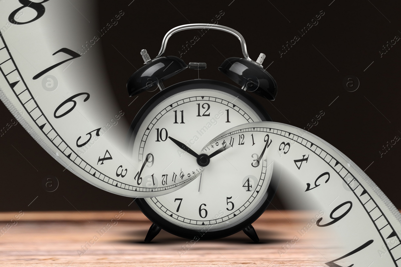 Image of Infinity and other time related concepts. Alarm clock face twisted in spiral, fractal pattern