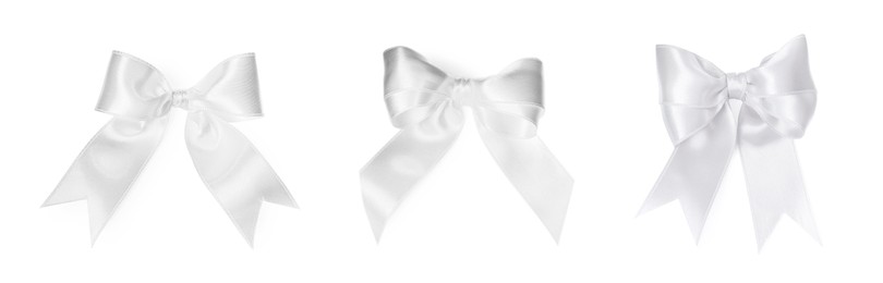 Image of White satin ribbon bows isolated on white, set