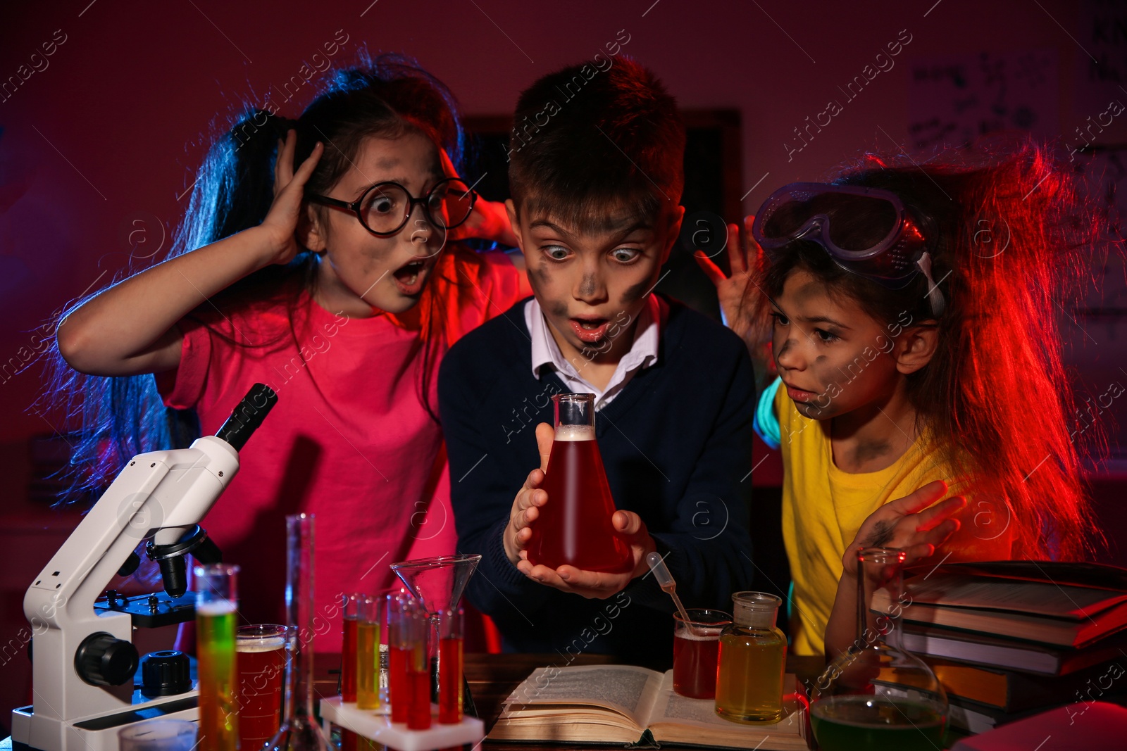 Photo of Children doing chemical research in laboratory. Dangerous experiment