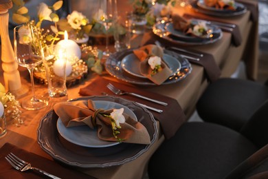 Photo of Elegant table setting with beautiful floral decor