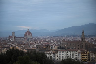 Florence, Italy - February 8, 2024: Picturesque view of city with beautiful buildings and mointains