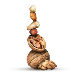 Stack of different nuts on white background