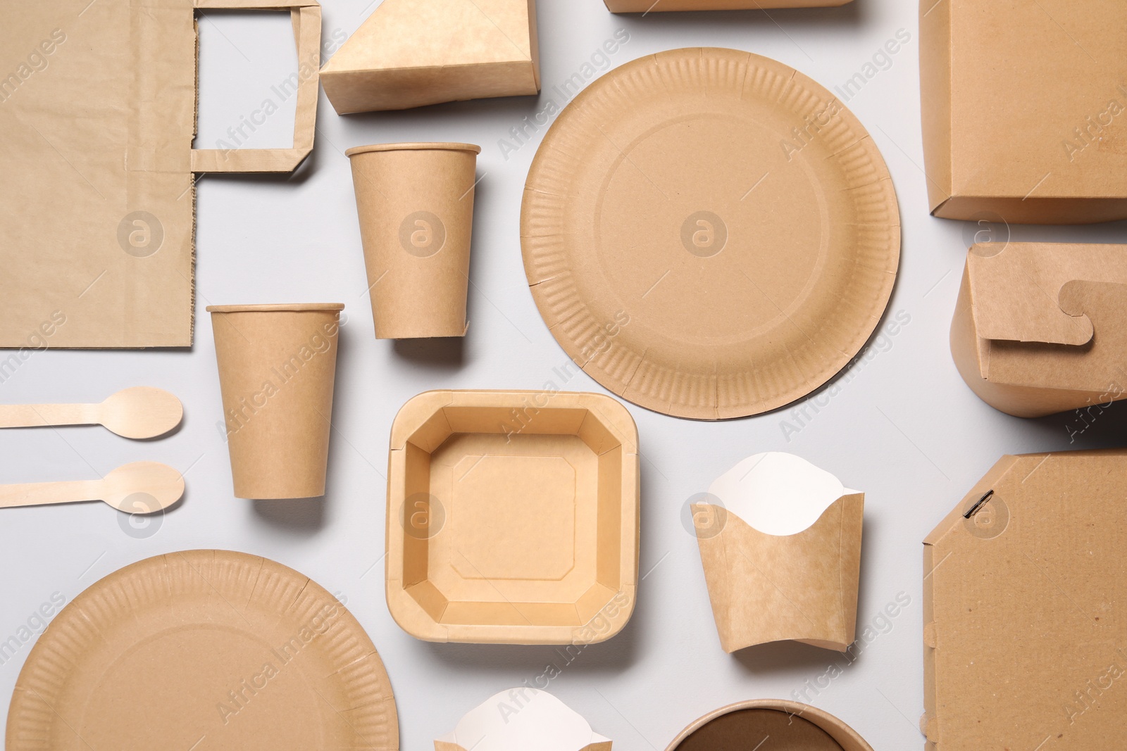 Photo of Flat lay composition with eco friendly food packagings on light grey background