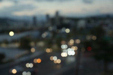 Blurred view of cityscape in evening. Bokeh effect