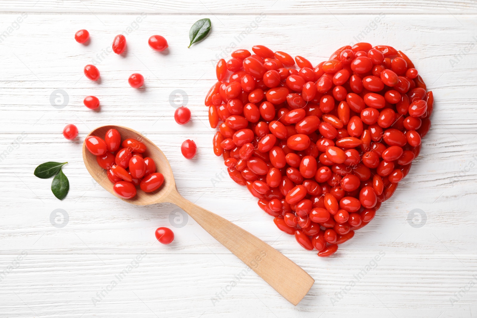 Photo of Flat lay composition with fresh ripe goji berries on white wooden table