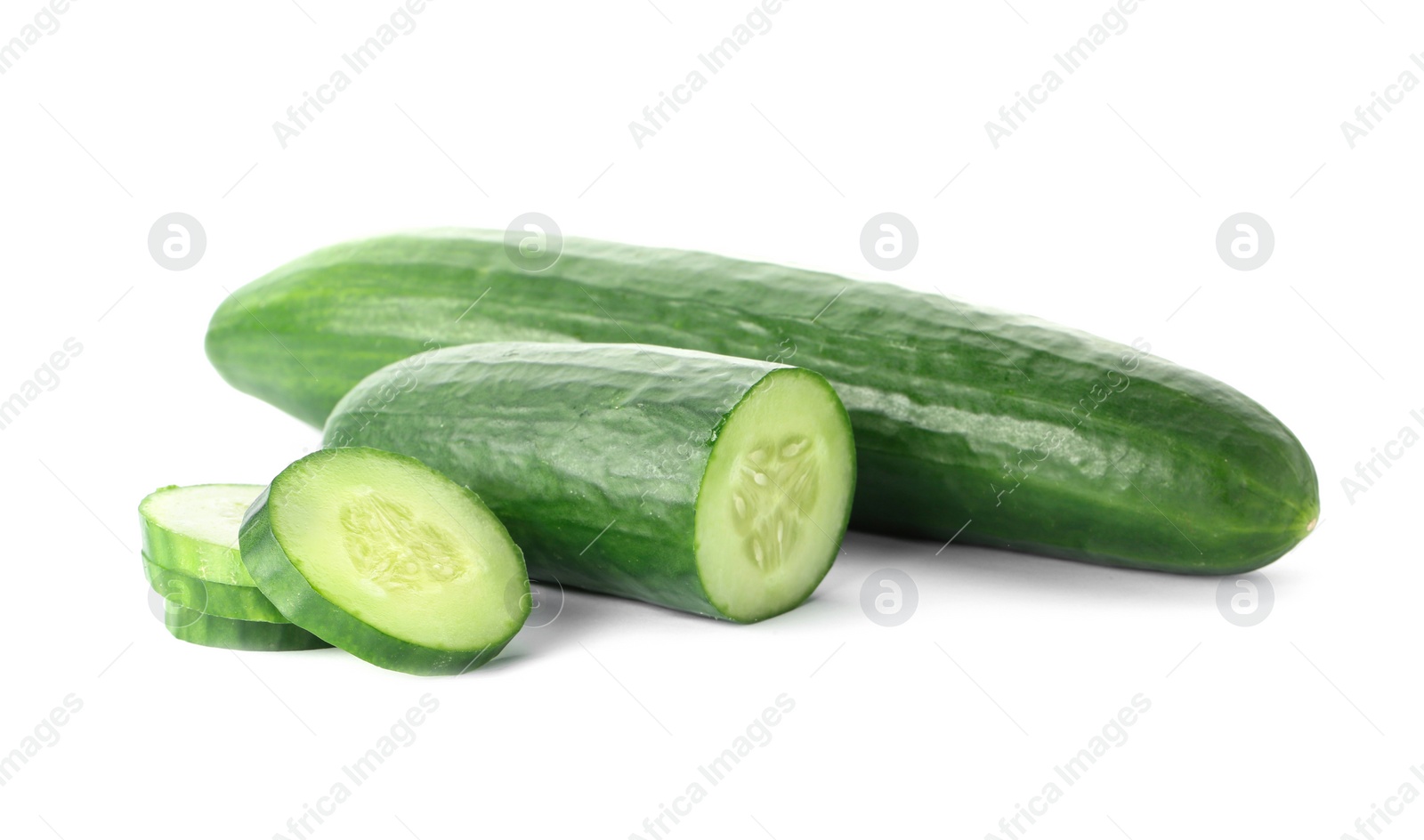 Photo of Whole and sliced fresh cucumbers on white background