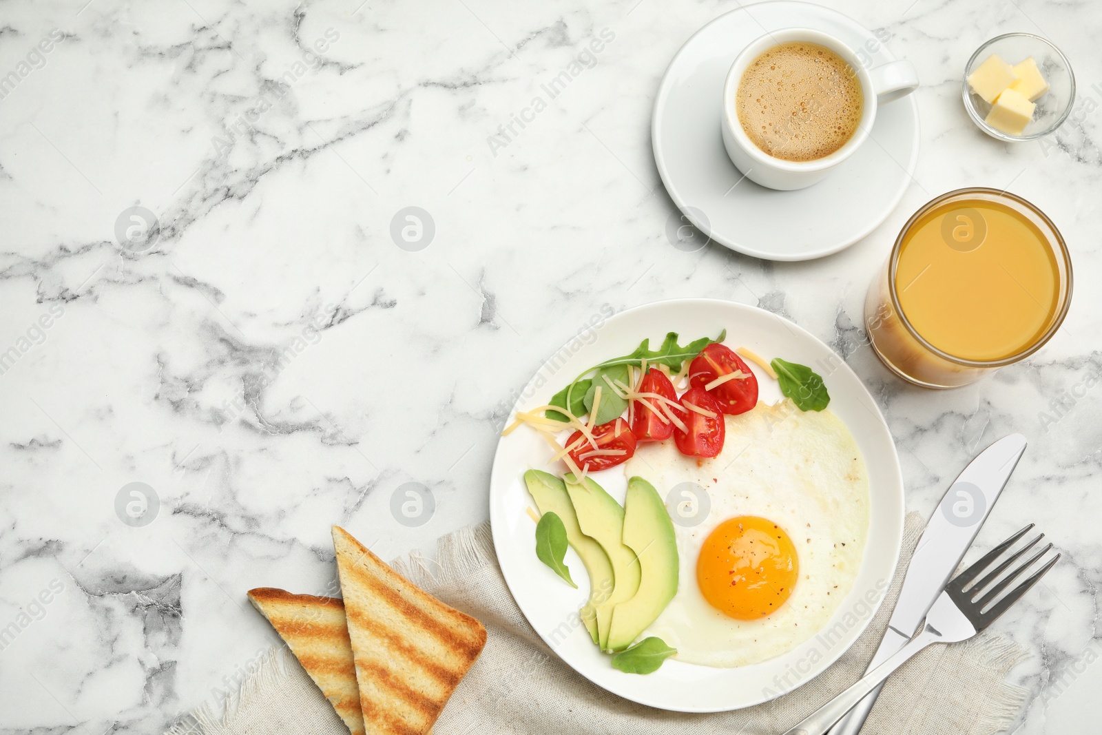 Photo of Tasty breakfast with fried egg served on white marble table, flat lay. Space for text