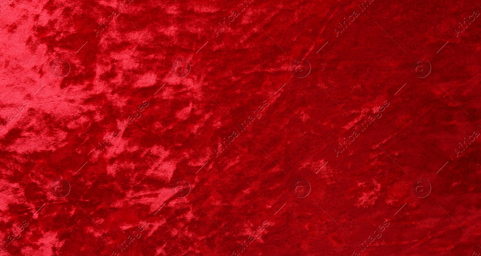 Photo of Texture of red velvet fabric as background, top view