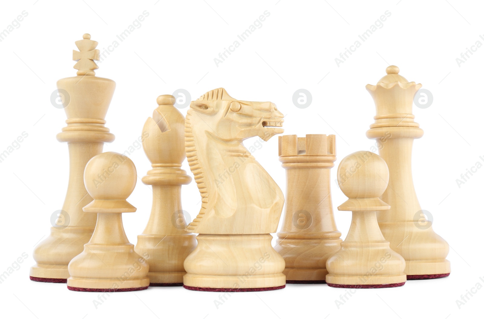 Photo of Set of wooden chess pieces on white background