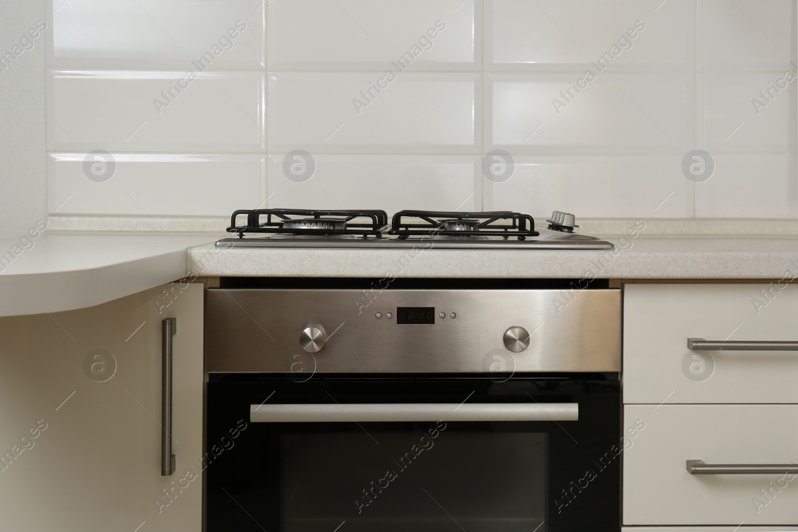 Photo of New gas stove and oven in stylish kitchen