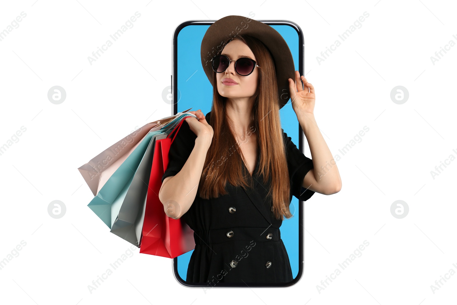 Image of Online shopping. Stylish woman with paper bags looking out from smartphone on white background