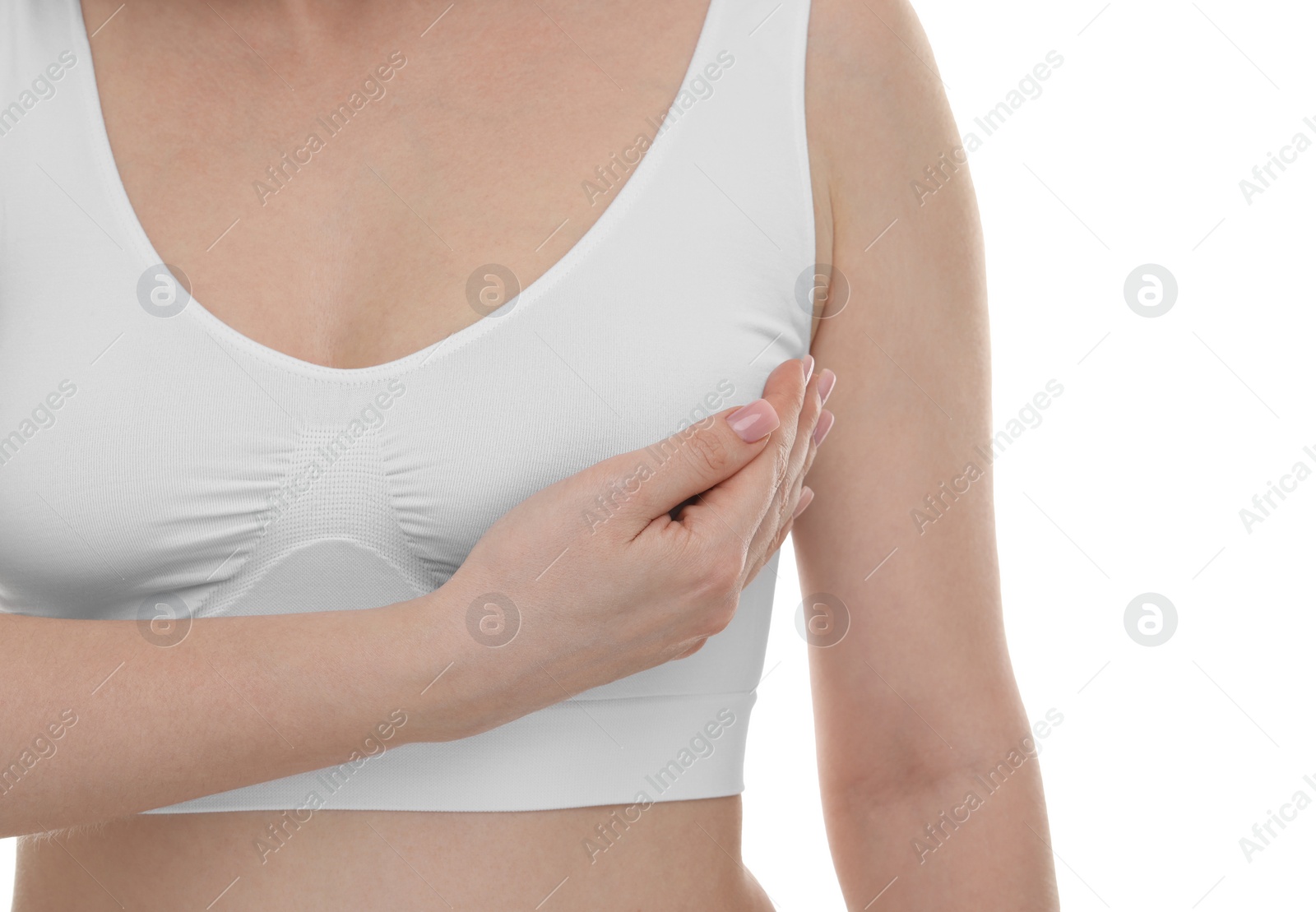 Photo of Mammology. Young woman doing breast self-examination on white background, closeup