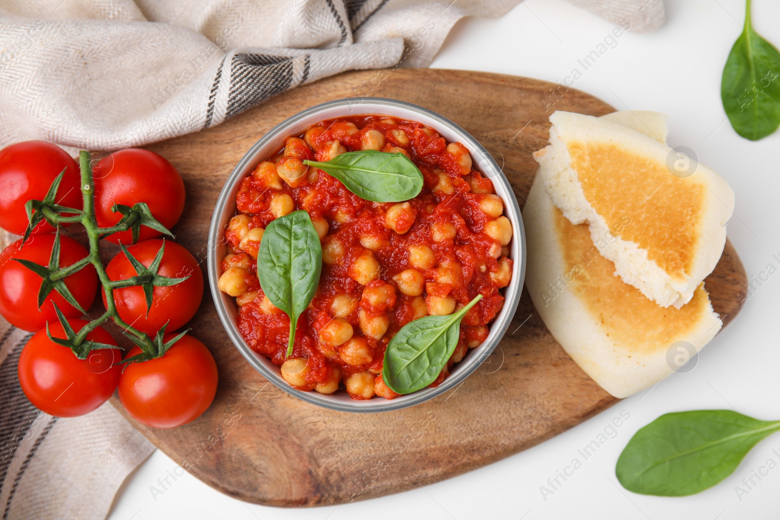 Photo of Delicious chickpea curry served on white table, flat lay