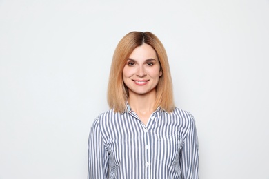 Photo of Portrait of woman with beautiful face on white background