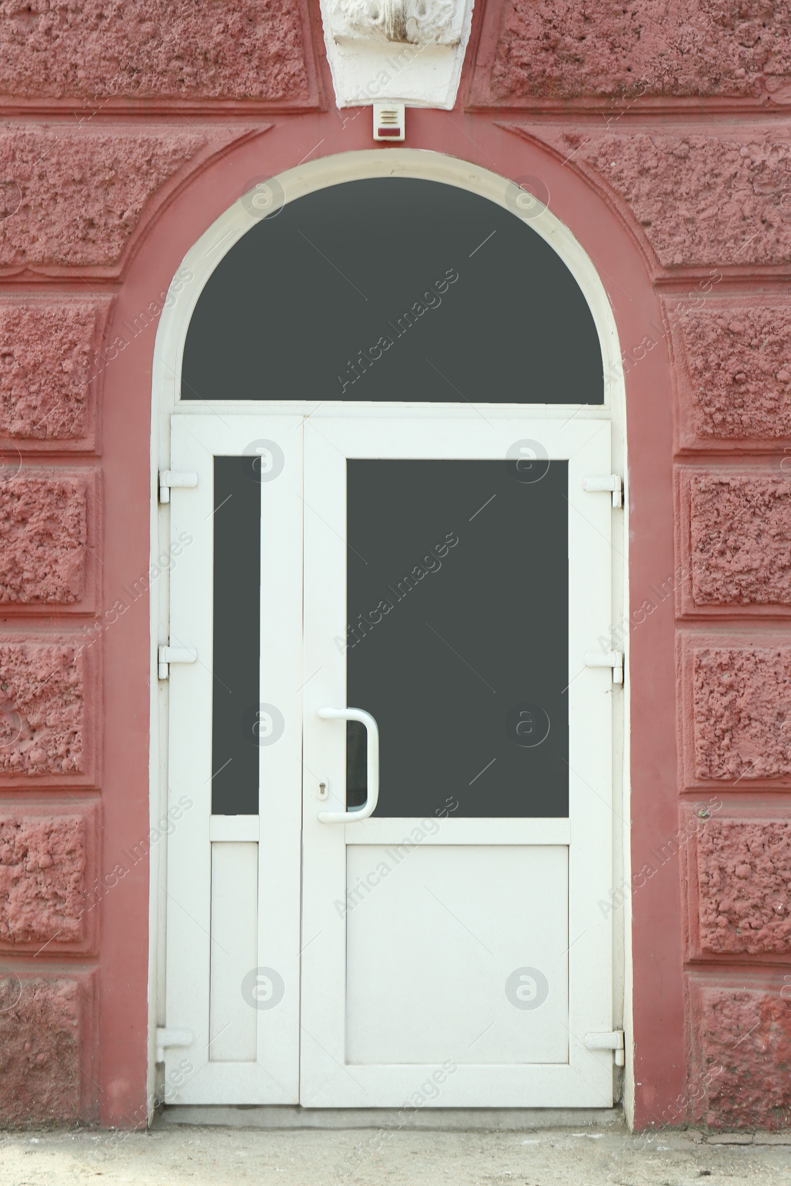 Photo of Building entrance with white modern PVC external door