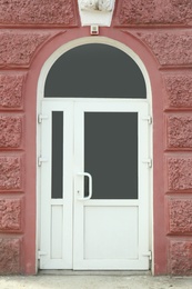 Building entrance with white modern PVC external door