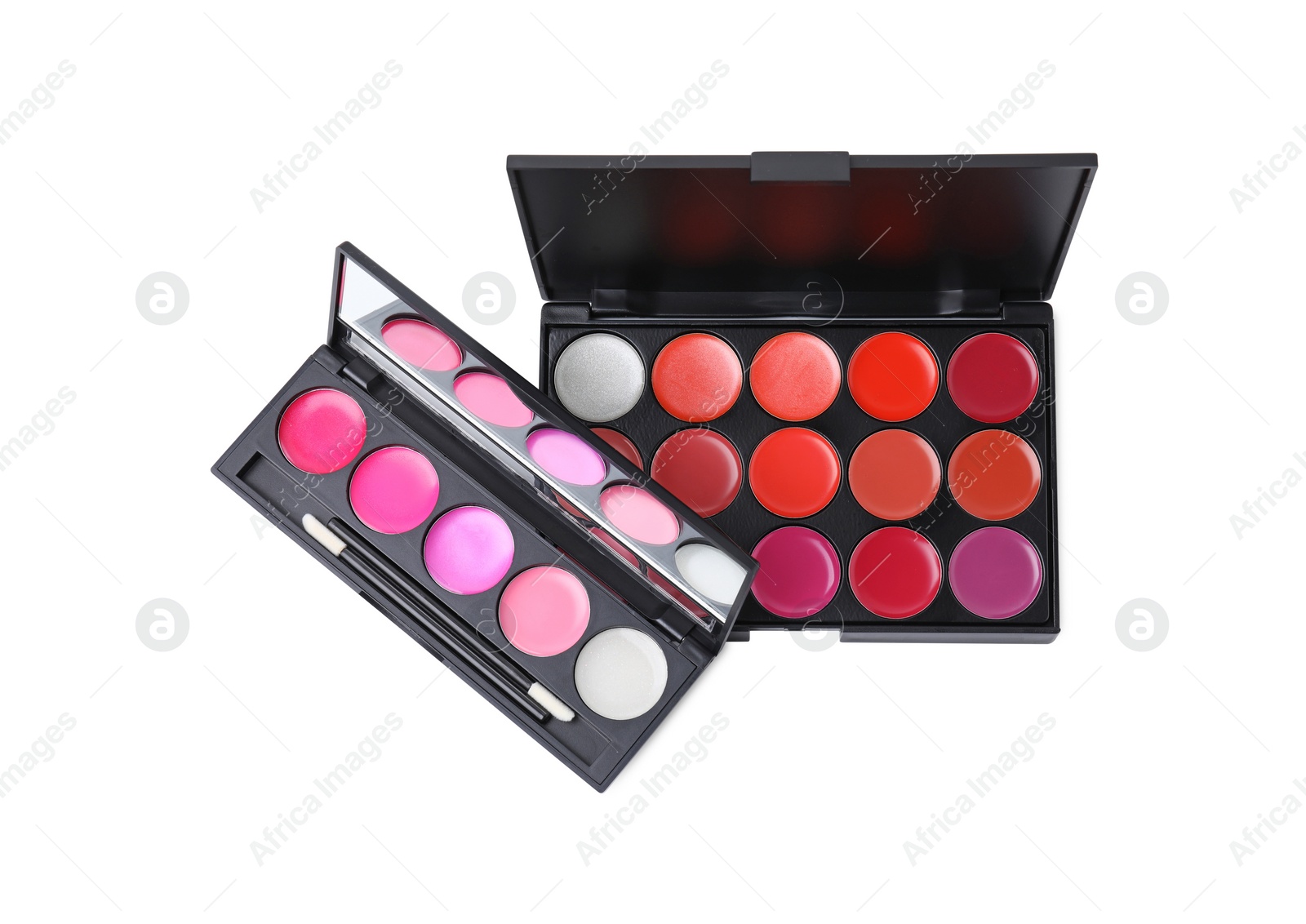 Photo of Colorful lip palettes with brush isolated on white, top view. Professional cosmetic product