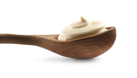 Photo of Natural yogurt in wooden spoon isolated on white