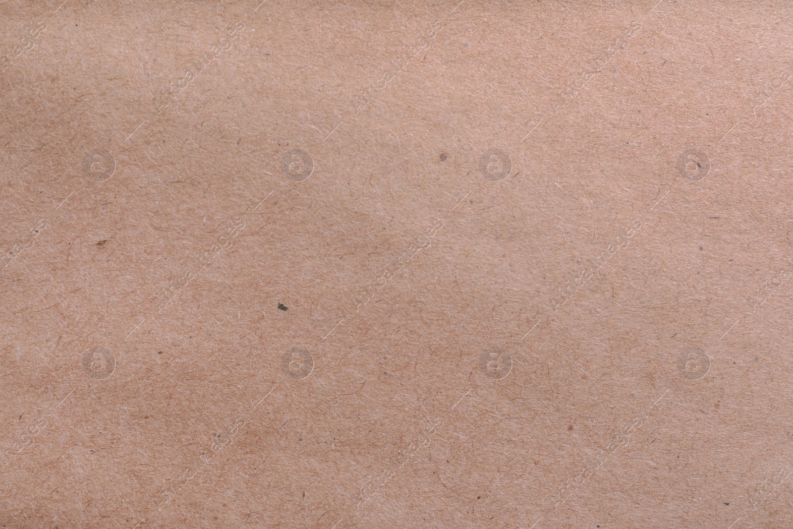 Photo of Texture of kraft paper bag as background, closeup