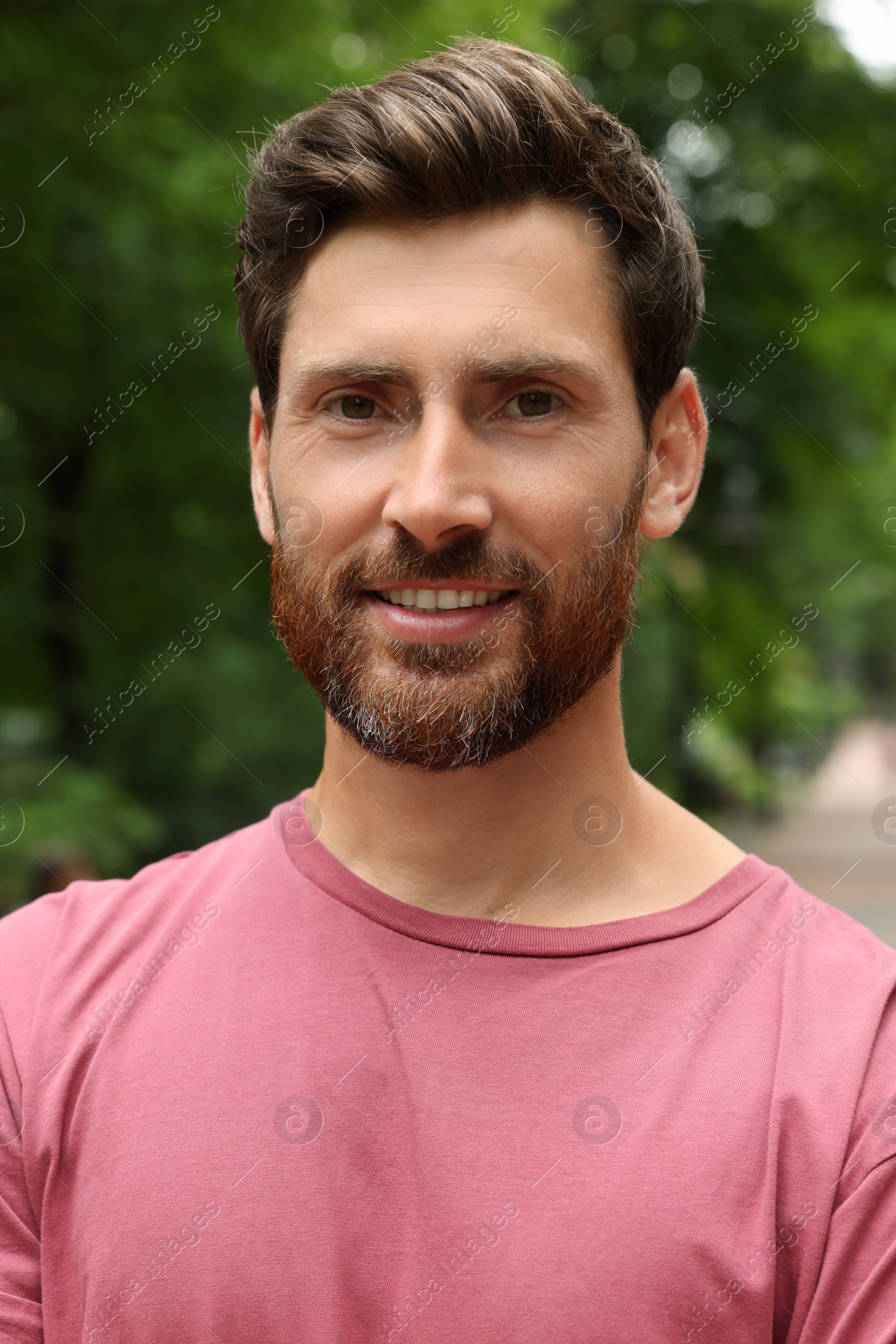 Photo of Portrait of handsome bearded man in park