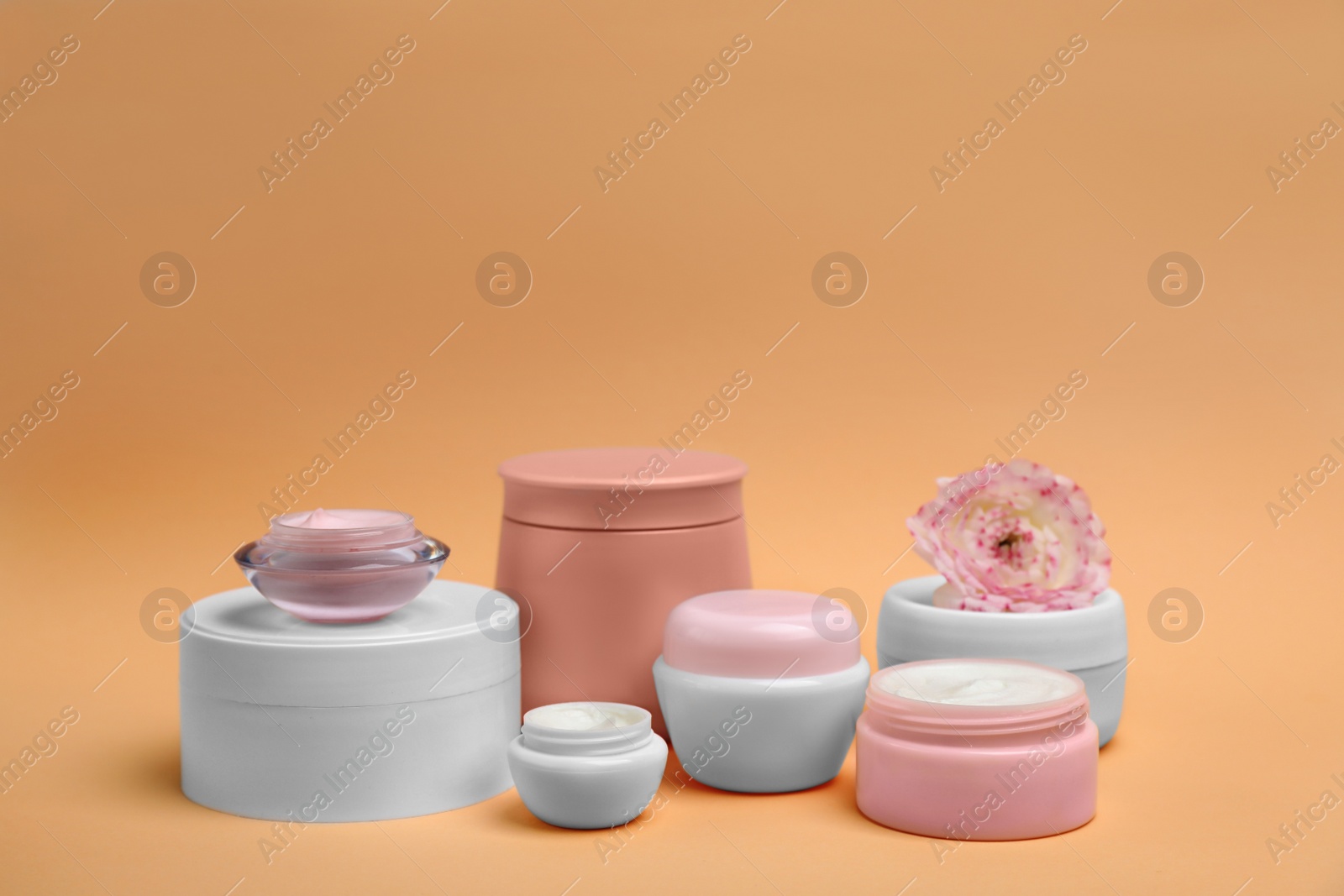 Photo of Composition with cosmetic products on color background