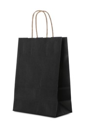 Blank black paper bag on white background. Space for design