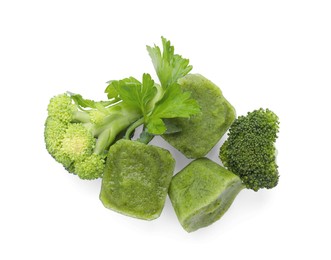 Photo of Frozen broccoli puree cubes and fresh broccoli isolated on white, top view
