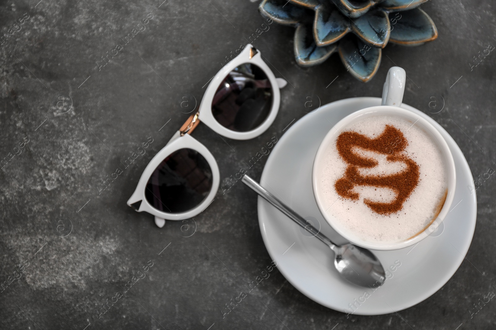 Photo of Cup of fresh aromatic coffee on table, top view