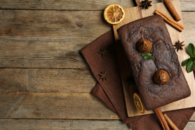 Photo of Flat lay composition with tasty pear bread on wooden table, space for text. Homemade cake