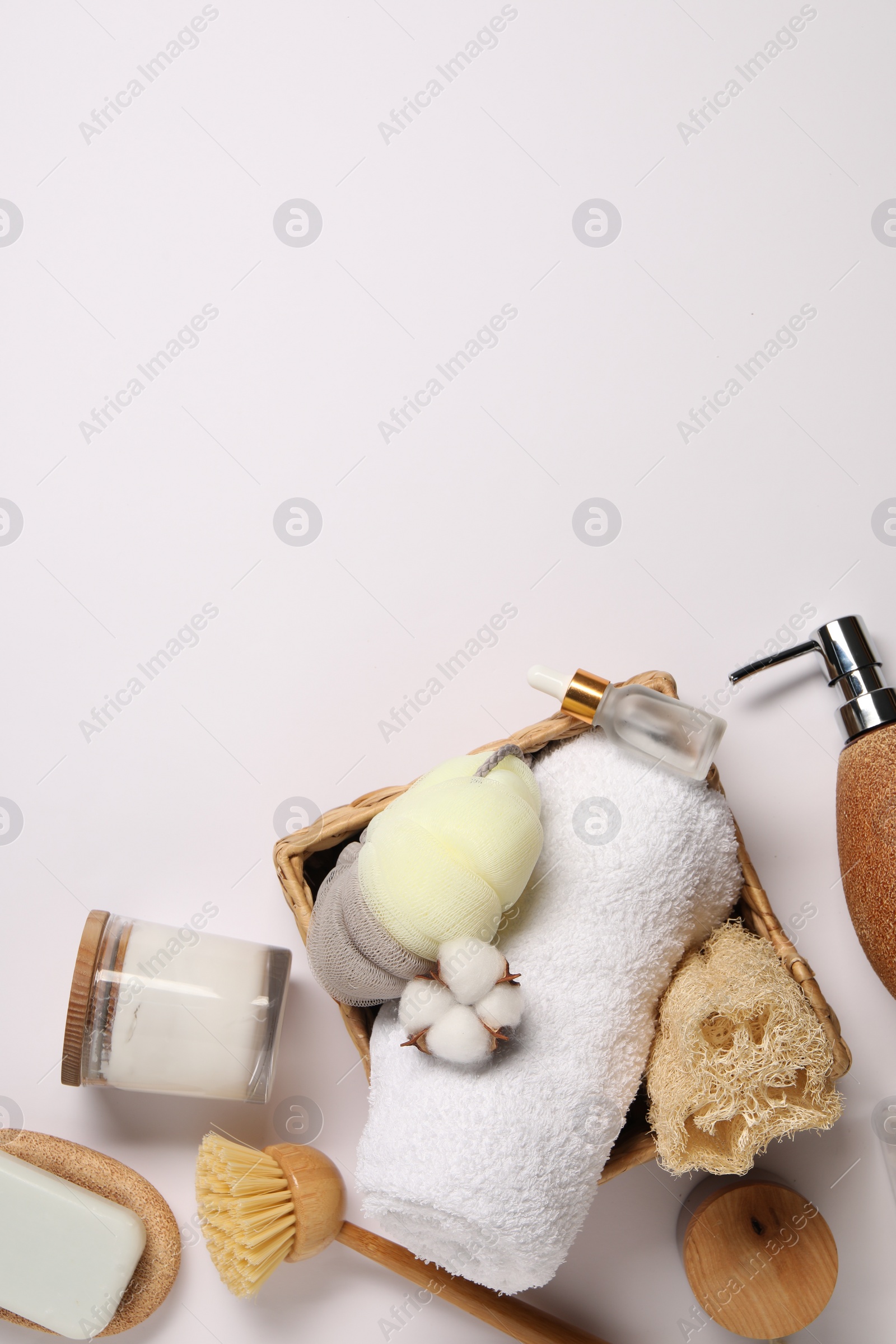 Photo of Bath accessories. Different personal care products and cotton flower on white background, flat lay with space for text