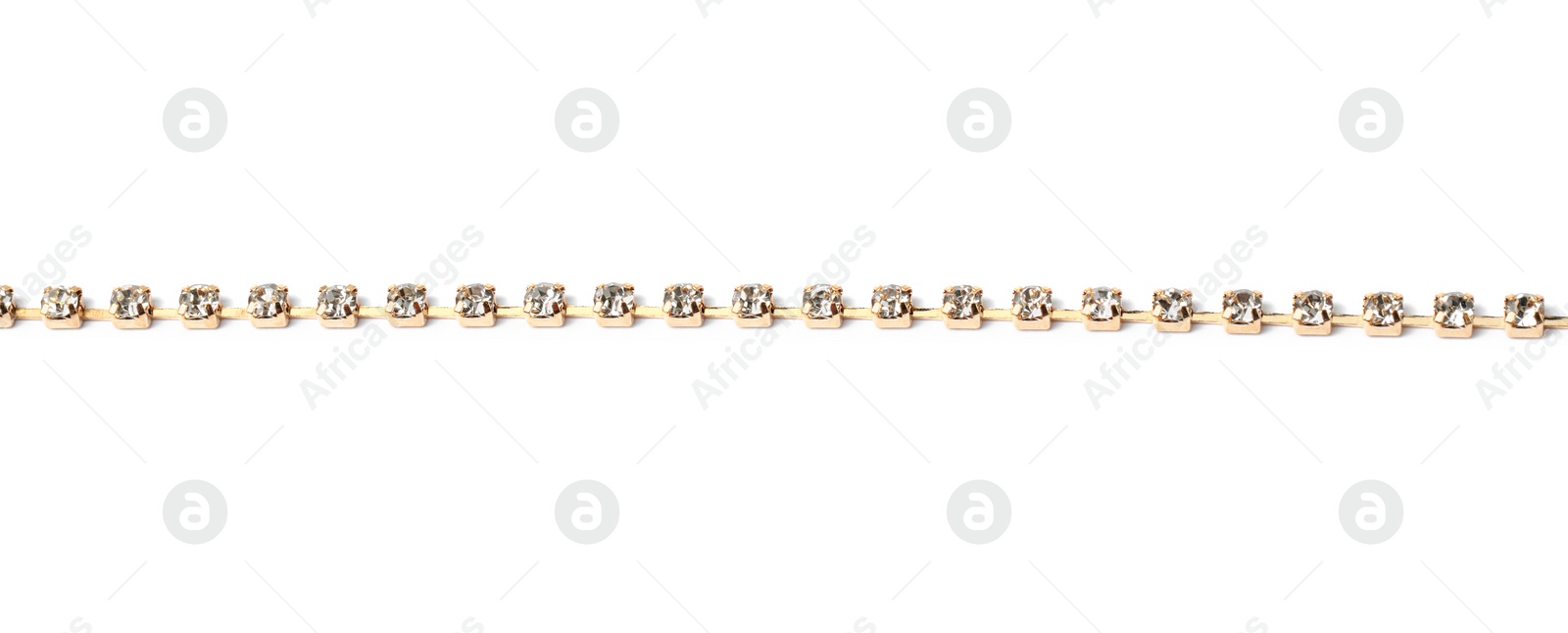 Photo of One metal chain with gemstones isolated on white,. Luxury jewelry