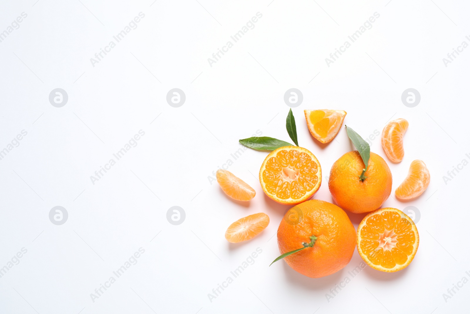 Photo of Composition with fresh ripe tangerines and leaves on white background, flat lay. Citrus fruit