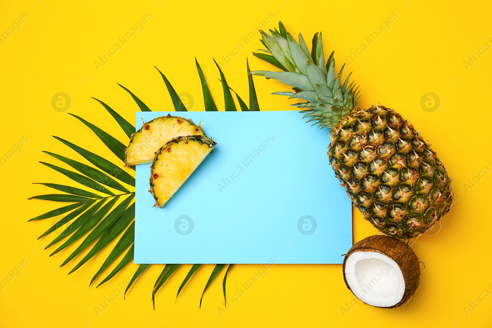 Photo of Fresh pineapples and coconut on color background, flat lay