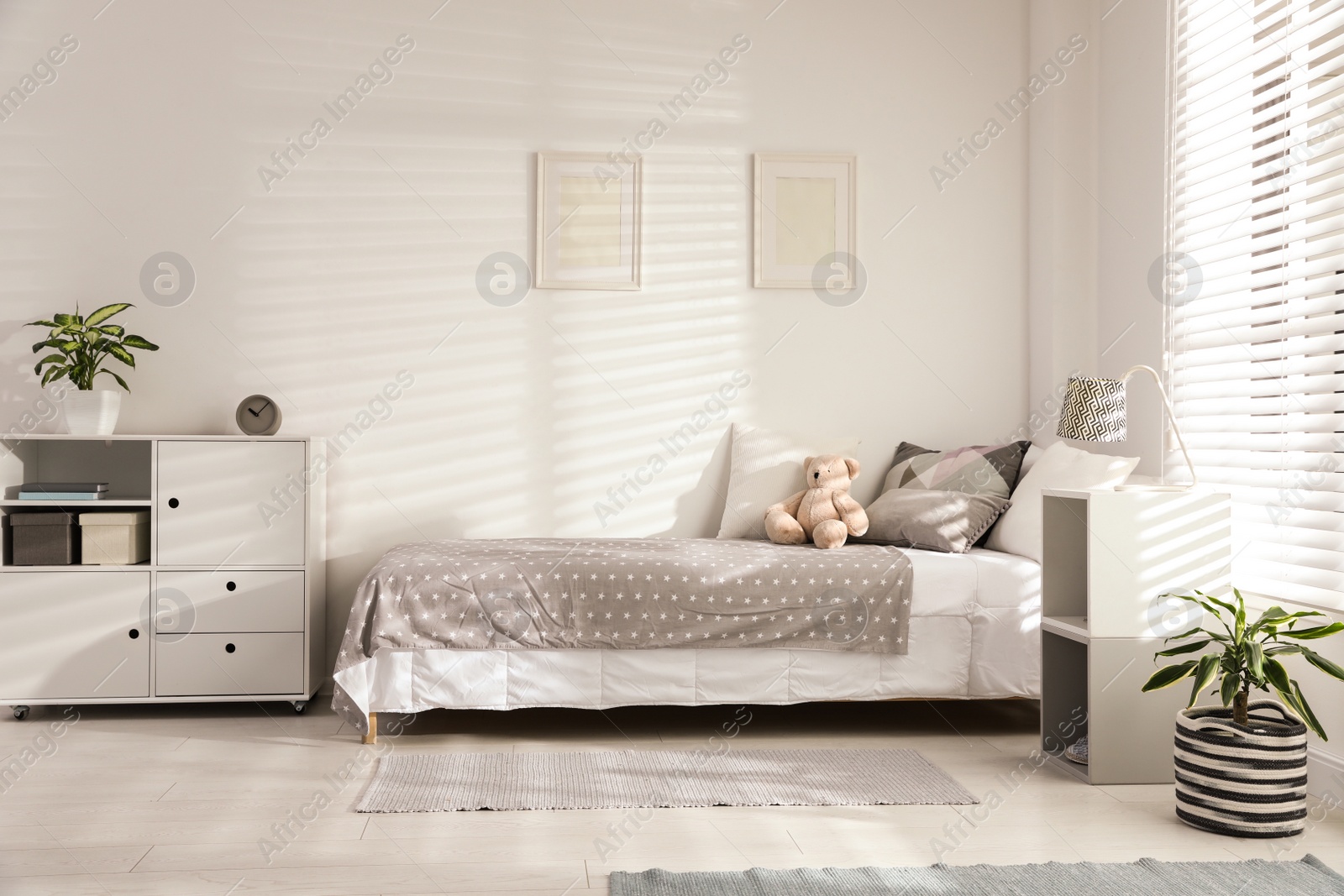 Photo of Modern child room interior with comfortable bed