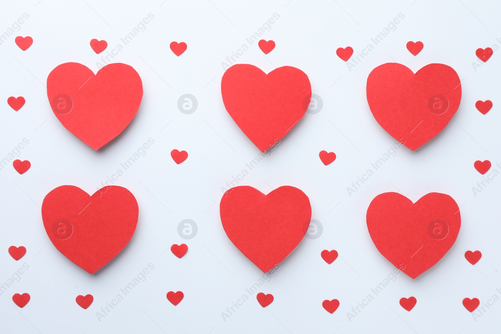 Photo of Paper hearts on white background, flat lay