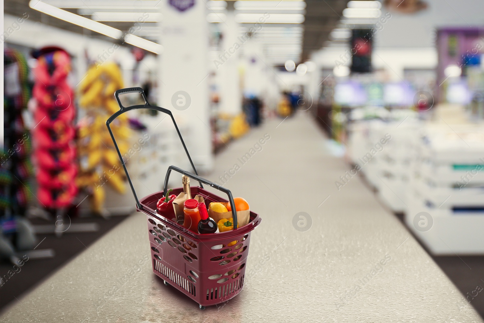 Image of Shopping basket full of products in mall