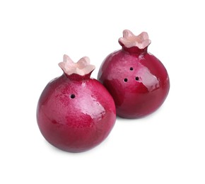 Photo of Pomegranate shaped salt and pepper shakers isolated on white