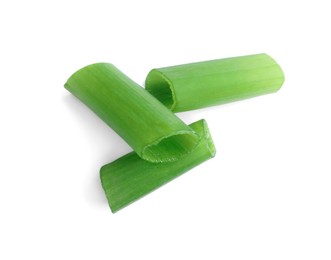 Photo of Pieces of fresh green onion on white background